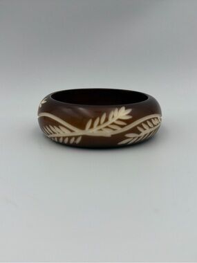 Brown Bracelet with Carved Cream Leaf Motif